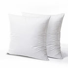 Two white pillows on a light gray background