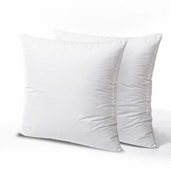 Two white pillows on a light gray background